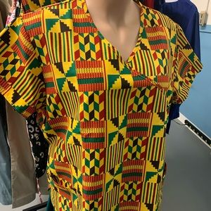Two Pocket scrub top. Multi color, yellow/gold, red, green in color. I have 2.